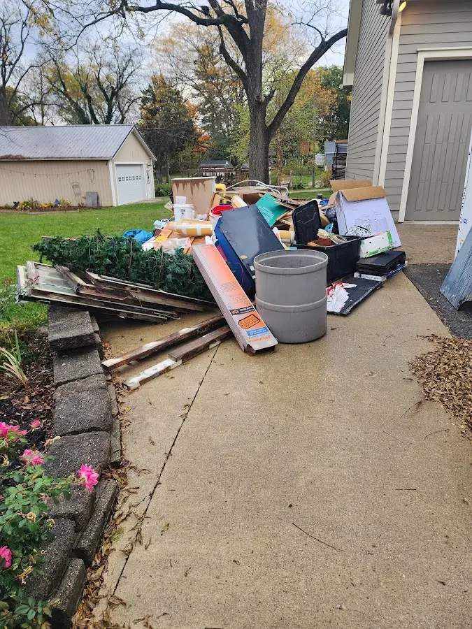 Dumpster being loaded with debris for Roofing Dumpster Rental in Marion Oaks